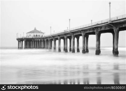 Black and white photo of Manhattan beach pier, California.