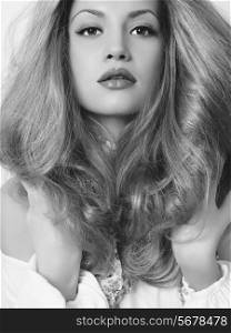 Black and white photo of young beautiful lady with blond hair