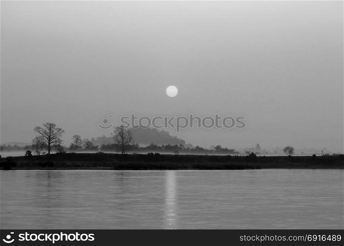 black and white picture, beautiful sunrise over the river