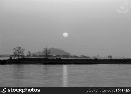 black and white picture, beautiful sunrise over the river