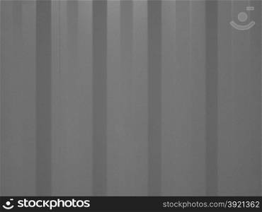 Black and white Pink corrugated steel background. Pink corrugated steel texture useful as a background in black and white