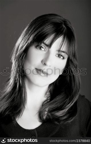 Black and White portrait of a beautiful young woman with a lovely espression