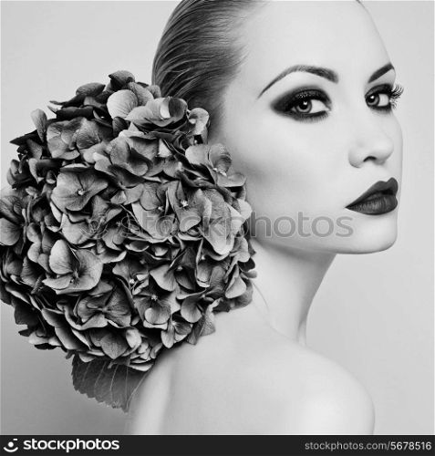 Black and white portrait of beautiful lady with hydrangea