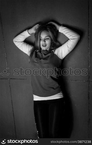 Black and white portrait of sexy blonde woman in sporty hoodie