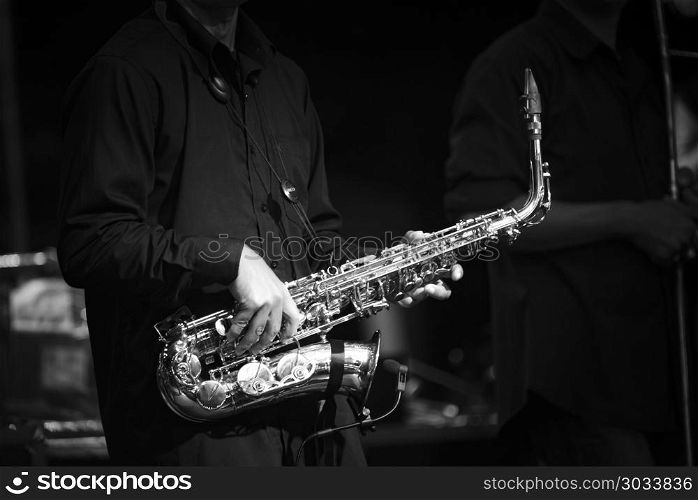 black and white saxophone playing