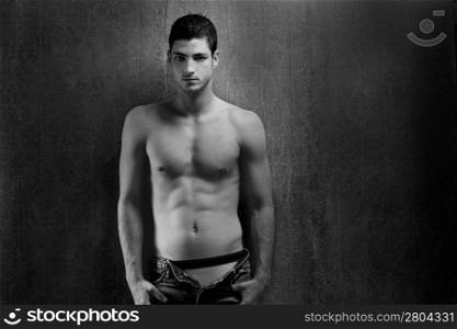 Black and white sexy young denim shirtless man on retro grunge background