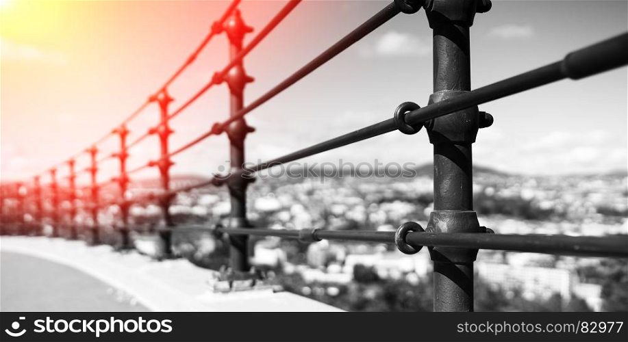 Black and white steel border fence with light leak background. Black and white steel border fence with light leak background hd