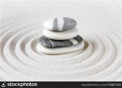 Black and white stones in the sand. Zen japanese garden background scene. Zen japanese garden background