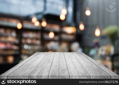 Black and white table top wood with coffee shop blurred background with bokeh