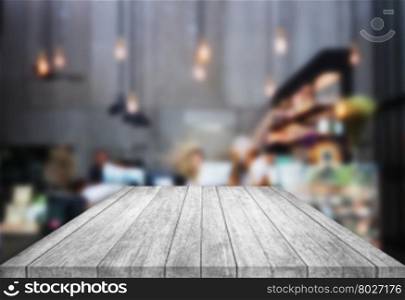 Black and white table top wooden with blurred background in coffee shop, stock photo