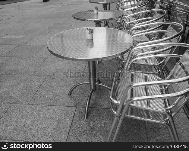 Black and white Tables and chairs. Tables and chairs of a dehors alfresco bar restaurant pub in black and white