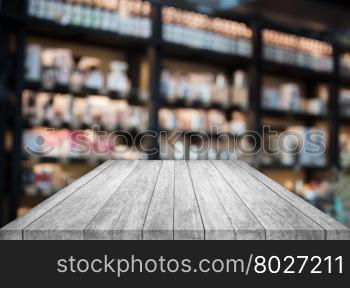 Black and white tabletop wooden with blurred cafe background. product display template