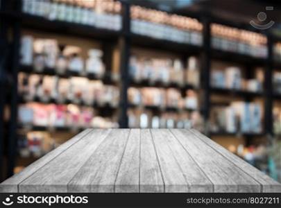 Black and white tabletop wooden with blurred cafe background. product display template