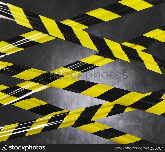 Black and yellow plastic barrier tape blocking the way.