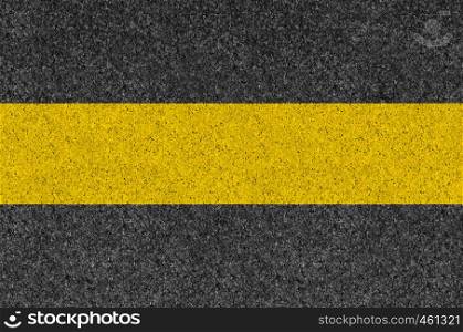 Black asphalt background texture with horizontal yellow line. Black asphalt background texture with yellow line