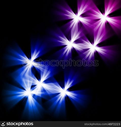 Black background with multiple colourful shining stars