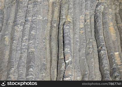 Black basalt strips on the rock, Israel