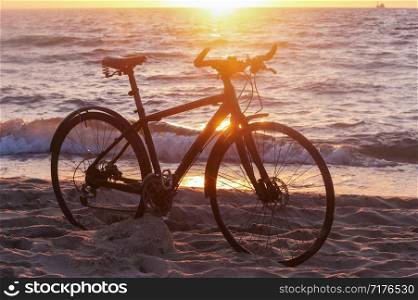black bike by the sea, bike and sunset by the sea. bike and sunset by the sea, black bike by the sea