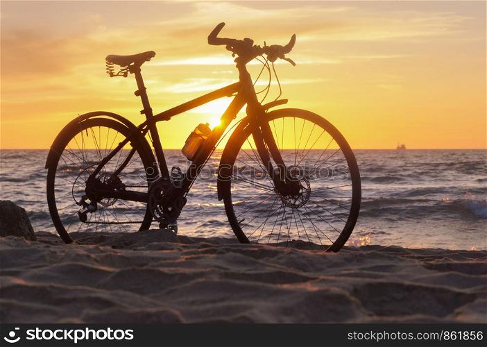 black bike by the sea, bike and sunset by the sea. bike and sunset by the sea, black bike by the sea
