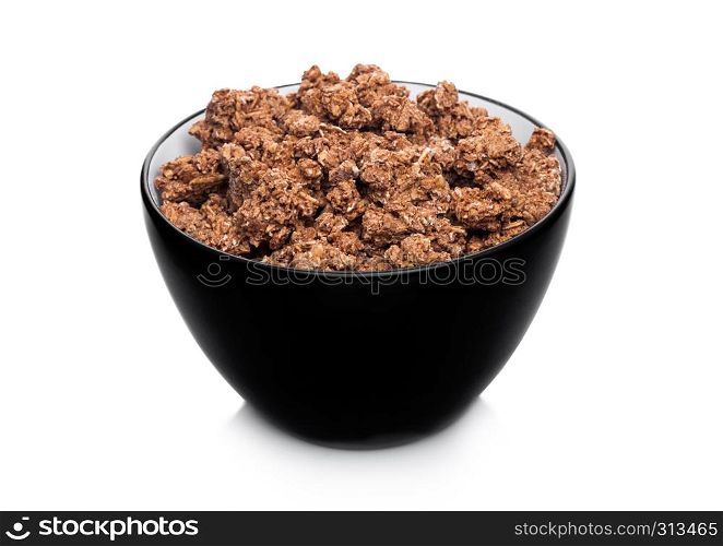Black bowl with natural organic chocolate granola cereal on white