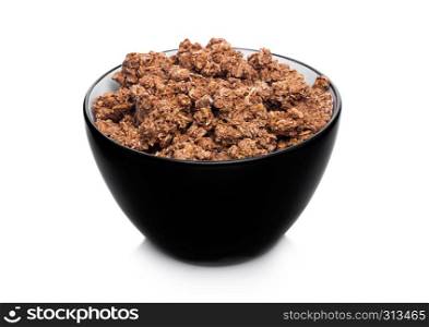 Black bowl with natural organic chocolate granola cereal on white