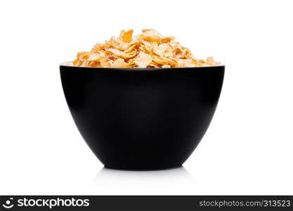 Black bowl with natural organic granola cereal corn flakes on white