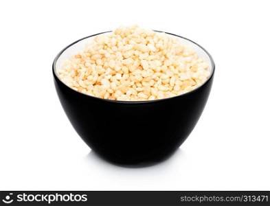 Black bowl with natural organic granola cereal corn rice on white