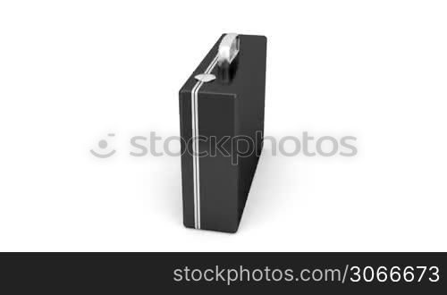 Black briefcase rotates on white background