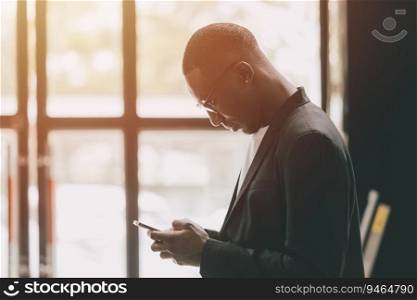 black business man using smartphone touch screen for contact people