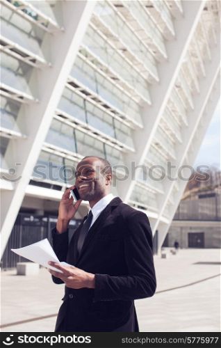 black businessman have phone conversation outdoors