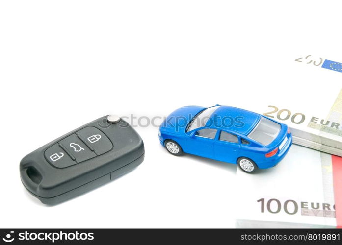black car keys, blue car and euro notes on white