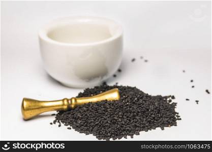 black caraway seeds with mortar