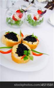Black caviar in the plate