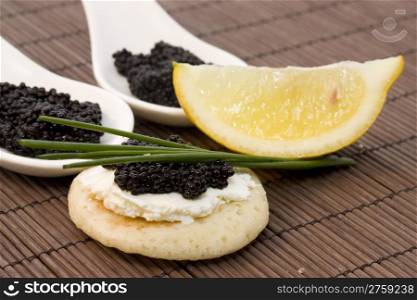 black caviar. photo of some snacks with fresh black caviar