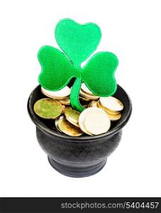 Black ceramic pot with golden coins and shamrock isolated on white. St. Patrick Day concept