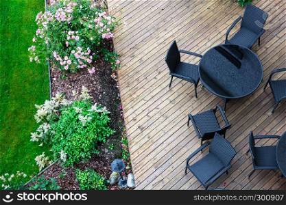 black chairs and a table in the rain