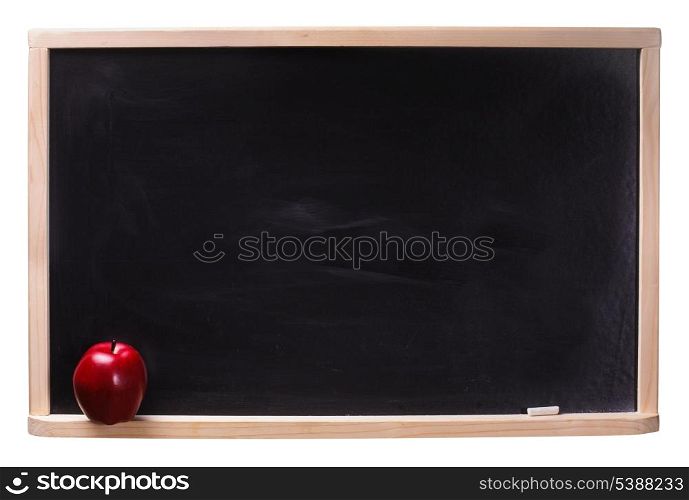 Black chalkboard with chalk piece and red apple isolated on white