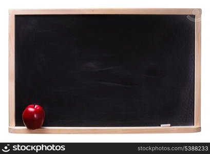 Black chalkboard with chalk piece and red apple isolated on white