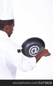 black chef with frying pan