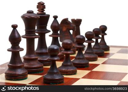 black chess pieces placed on chessboard close up