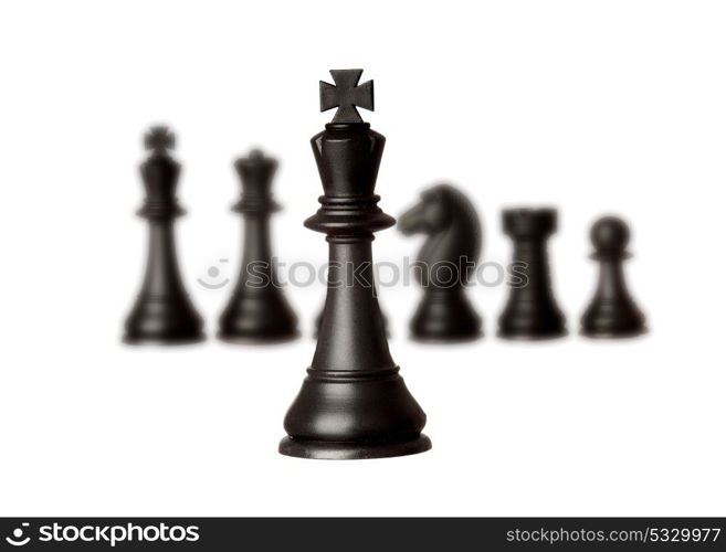 Black chess team with the king close-up isolated on a white background