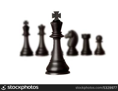 Black chess team with the king close-up isolated on a white background