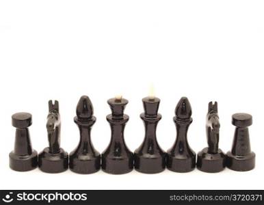 Black chessmen on a white background