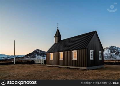 Black church Budakirkja in Snaefellsnes peninsula on sunset, West Iceland. Black church Budakirkja in Snaefellsnes peninsula, Iceland