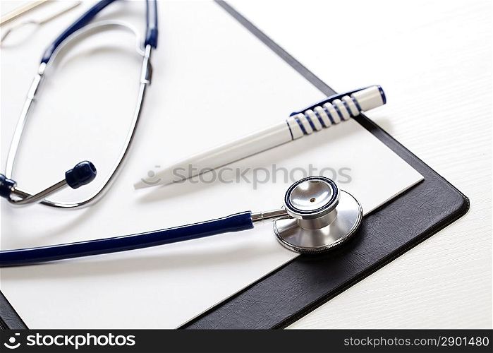 Black clipboard with stethoscope. Medicine concept.