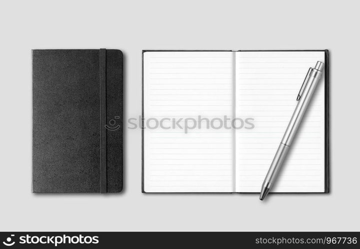 Black closed and open notebooks with pen isolated on grey background. Black closed and open notebooks with pen isolated on grey