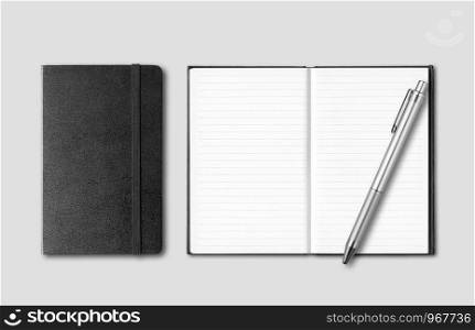 Black closed and open notebooks with pen isolated on grey background. Black closed and open notebooks with pen isolated on grey