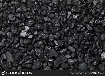 Black coal background. Pea coal. Top view