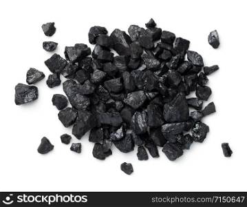 Black coal pile isolated on white background. Pea coal. Top view, flat lay