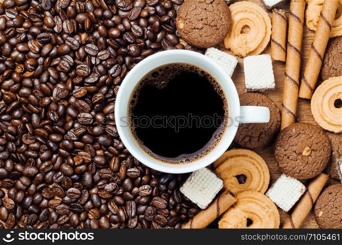 black coffee in white cup with cookie and dessert